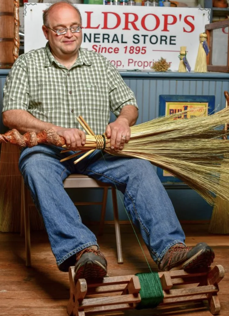 Marlow Gates making a broom