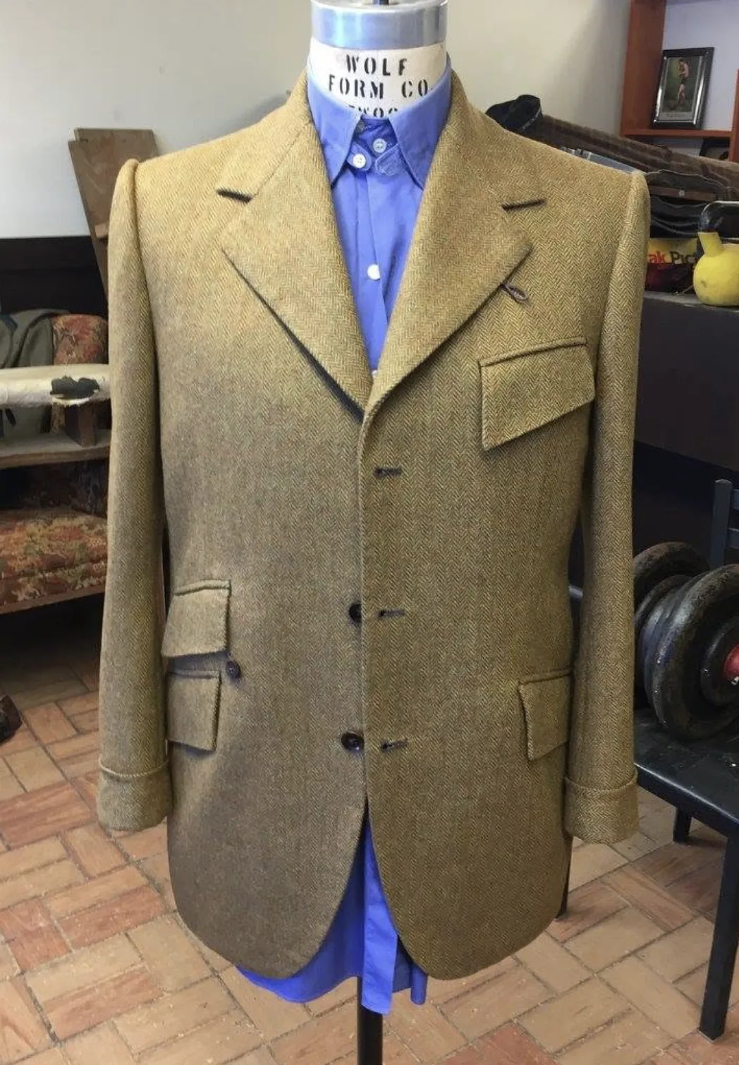 A tweed jacket on a tailor's form